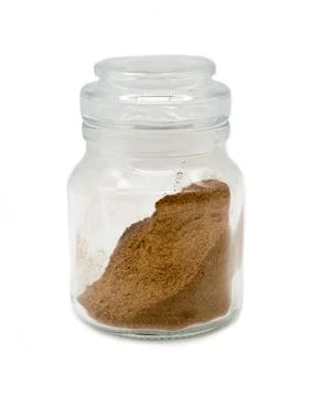 Ground nutmeg in a jar Stock Photos