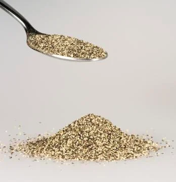 Ground Pepper on Tablespoon Stock Photos