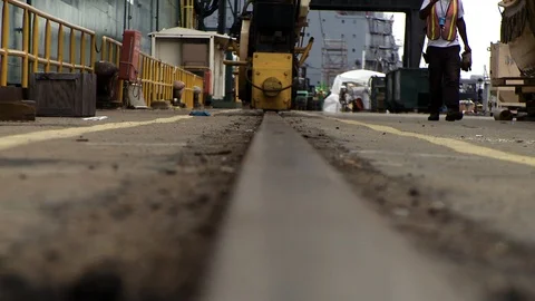 Ground POV camera with short focus on busy ship construction dock Stock Footage 123724497