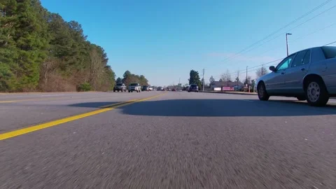 Ground POV view traffic at normal speeds trucks and cars Stock Footage 148695410