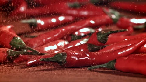 Ground red pepper falls on the table. Filmed on a high-speed camera at 1000 fps. Stock Footage 307993000