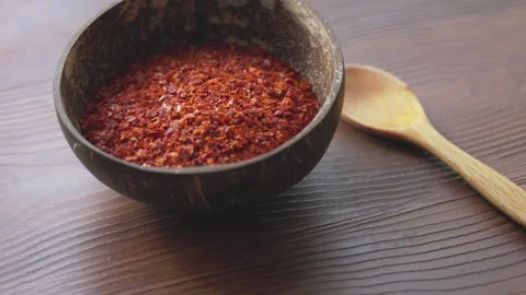 Ground Red Pepper Spice Served in a Natural Coconut Bowl with and Texture Stock Footage 323076613