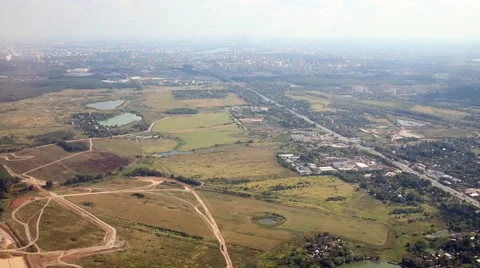 Ground with roads and settlements under aircraft Stock Footage 62348218