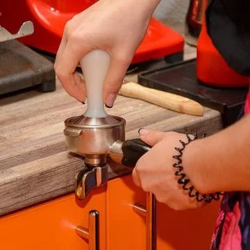 Ground roasted coffee in the filter holder for brewing in a coffee machine Stock Photos