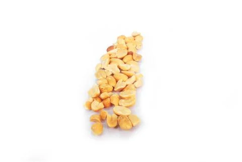 Ground roasted peanuts on white background. Stock Photos