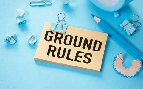 Ground rule open notepad with text on a blue background multi- colored stat.. Stock Photos