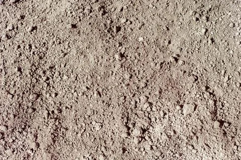 Ground seamless textured surface background under bright sunlight, closeup Stock Photos