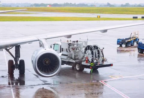 Ground services are servicing a passenger plane before it takes off for next Stock-Fotos