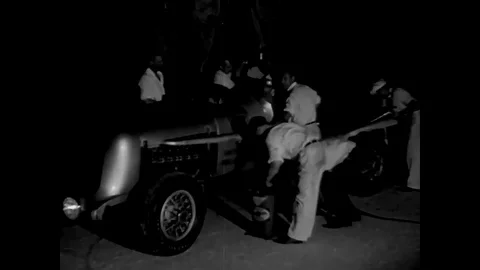 Ground speed records are broken by fast race cars on the salt beds of California Stock Footage 107668324