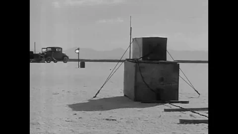 Ground speed records are broken by fast race cars on the salt beds of California Stock Footage 107668389