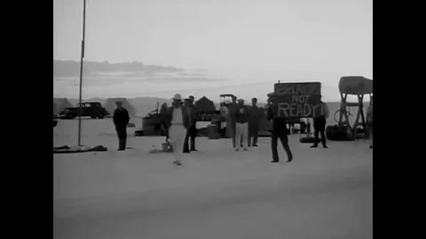 Ground speed records are broken by fast race cars on the salt beds of California Stock Footage 107668399