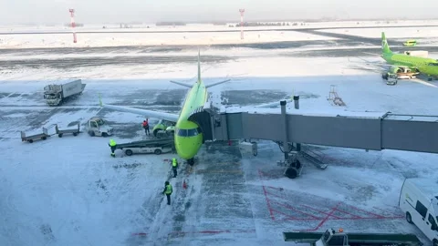 Ground staff working on luggage unloading at airport Stock Footage 327363532