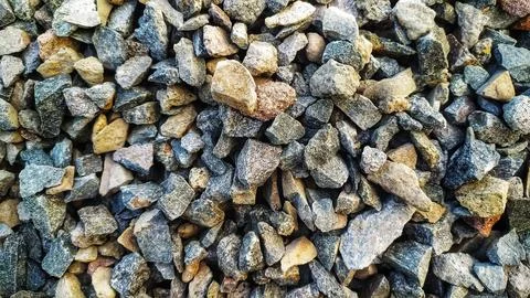 Ground stone background of many small stones. Stock Photos