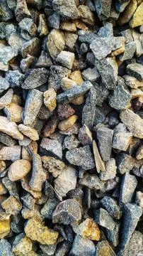 Ground stone background of many small stones. Stock Photos