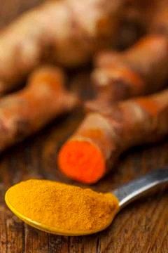 Ground tumeric on a plate Stock Photos