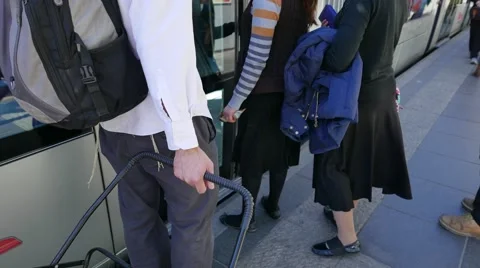 Ground View of Commuters Boarding Train 動画素材 57099298