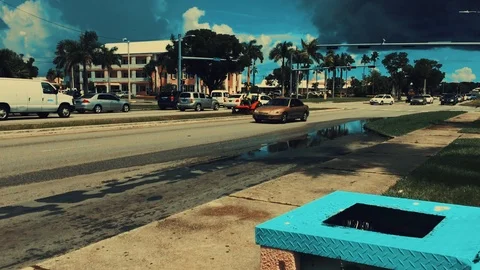 Ground View of Highway Bus Stop and Traffic Signal in Freeport Bahamas Stock Footage 94074320