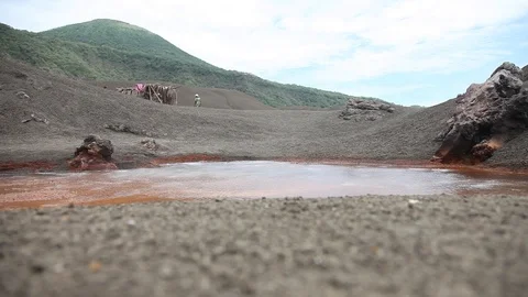 Ground view of hot red volcanic spring Stock Footage 89588234