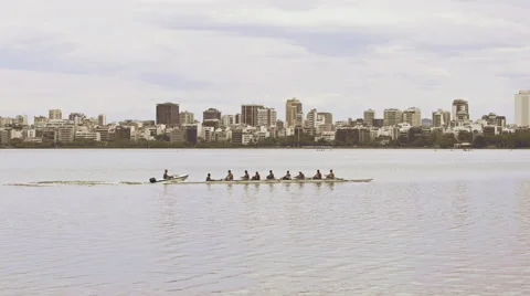 Ground view of Lago de Rodrigo Freitas Lagoon with Rowing team Stock Footage 64865126