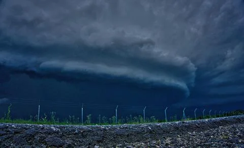 Ground view of a large storm cell of beautiful blue colors Stock Photos