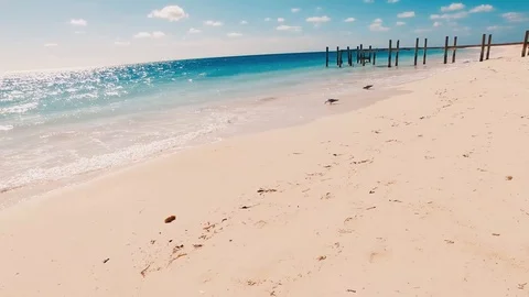Ground View of Old Taino Beach Dock and Tropical Water, Freeport Видео 98517609