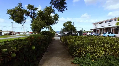 Ground View Walking Through Downtown Freeport Gardens, Grand Bahama Bahamas Stock Footage 98847180