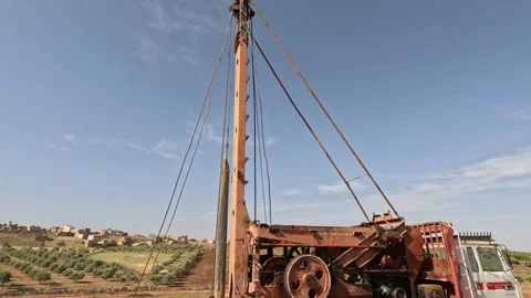 Ground water hole drilling machine Stock Footage 240990926