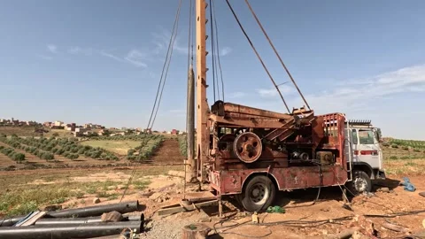 Ground water hole drilling machine installed on the old truck in Morocco. Stock Footage 241065533