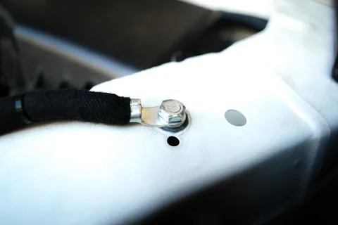 Ground wire or negative electrode on car chassis in engine compartment Stock Photos