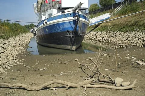 Grounded ship due to low stream gauge of rhine river in germany. Stock Photos
