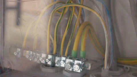 Grounding cables installation in an electrical panel for safety and performance Stock Footage 347203635