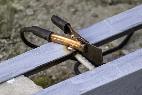 Grounding welding clamp with cable from the welding machine. Stock Photos