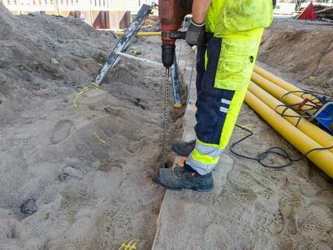 Groundwork and concrete drilling at infrastructure construction site Stock Photos