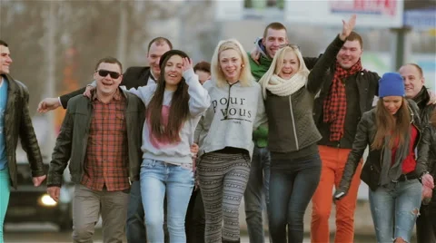A group of 12 people walking down the streets of the city Stock Footage 47954031