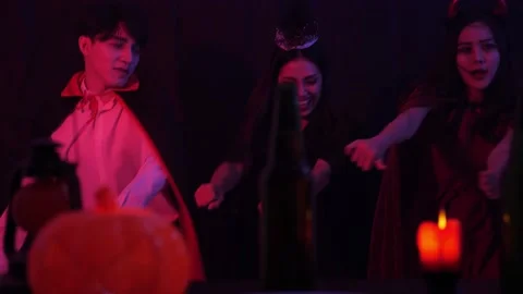 Group of 3 Young Asian dance like motorcycle ride, have fun at Halloween Party Stock Footage 138263099
