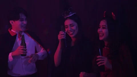 Group of 3 Young Asian drunk, cheers, dance, have fun at Halloween Nigh Party Stock Footage 138263089