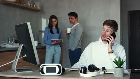 Group of 3 young people working together on a project and making strategy Stock Footage 152040349