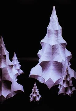 A group of 3D printed objects that look like white Christmas trees against a Stock Photos