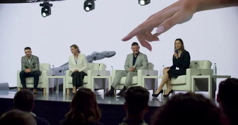 Group of 4 experts having a conversation on stage during AI future conference Stock Footage 245159773