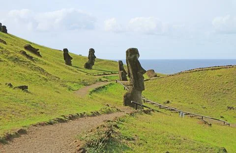 Group of abandoned massive Moai statues scattered on Rano Raraku volcano Photos