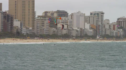 Group of about five parasailing surfers in Copacabana beach. Stock Footage 37217920