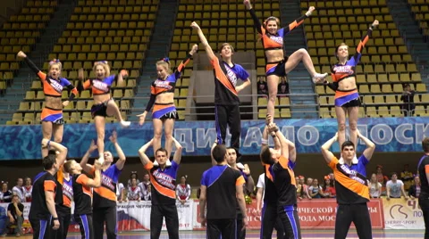 Group acrobatic performance of the cheerleading team Stock Footage 62732632