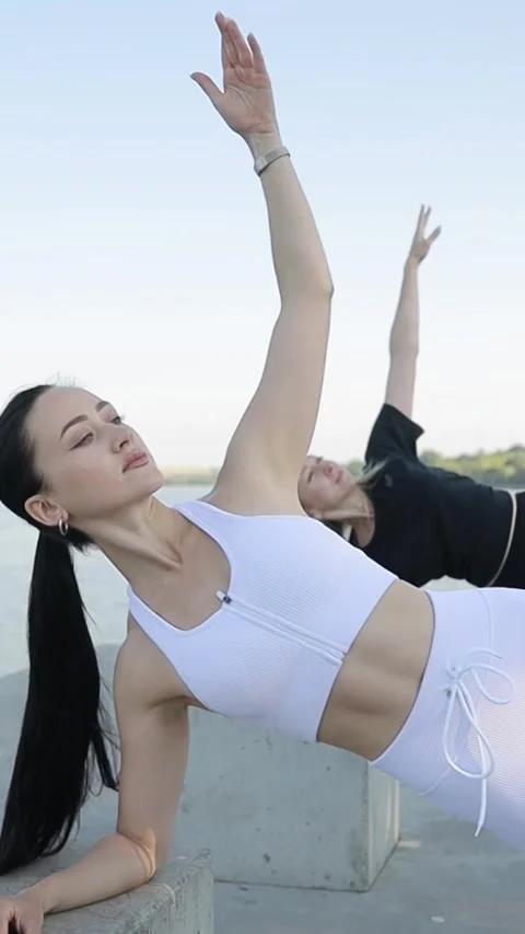 Group of active girls doing stretching exercises, slow motion camera. Vertical Stock Footage 250385728