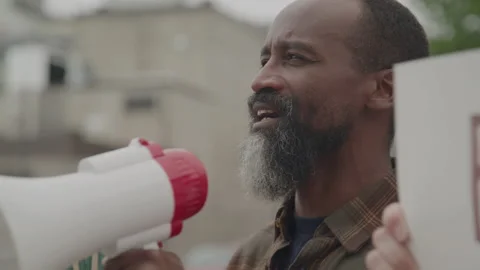 Group Of Activists With Megaphone At A Rally Stock Footage 219597180