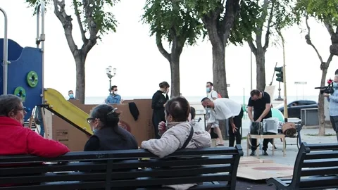 A group of actors prepares for a show in the square. Stock Footage 143114182