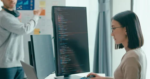 Group adult Asia software developers mentor leader manager talk prompt AI. Stock Footage 312194446