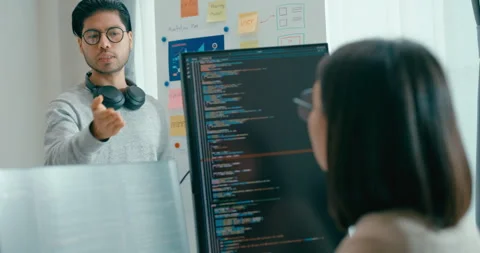 Group adult Asia software developers mentor leader manager talk prompt AI. Stock Footage 312194700