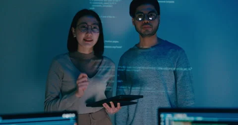 Group adult Asia software developers mentor leader manager talk prompt AI bot. Stock Footage 312201813