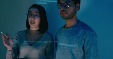 Group adult Asia software developers mentor leader manager talk prompt AI bot. Stock Footage 312203254