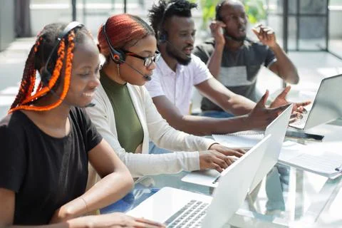 Group of african people working on laptops in a call centre Stock Photos
